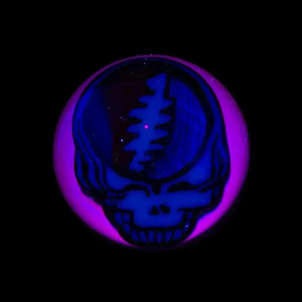 UV reactive marble with blue Steal Your Face skull design and purple glow