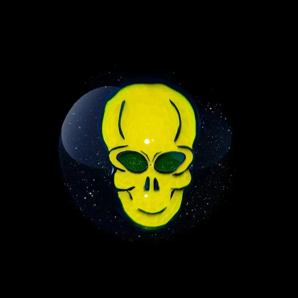 UV reactive alien skull heady glass marble with vibrant yellow and green details