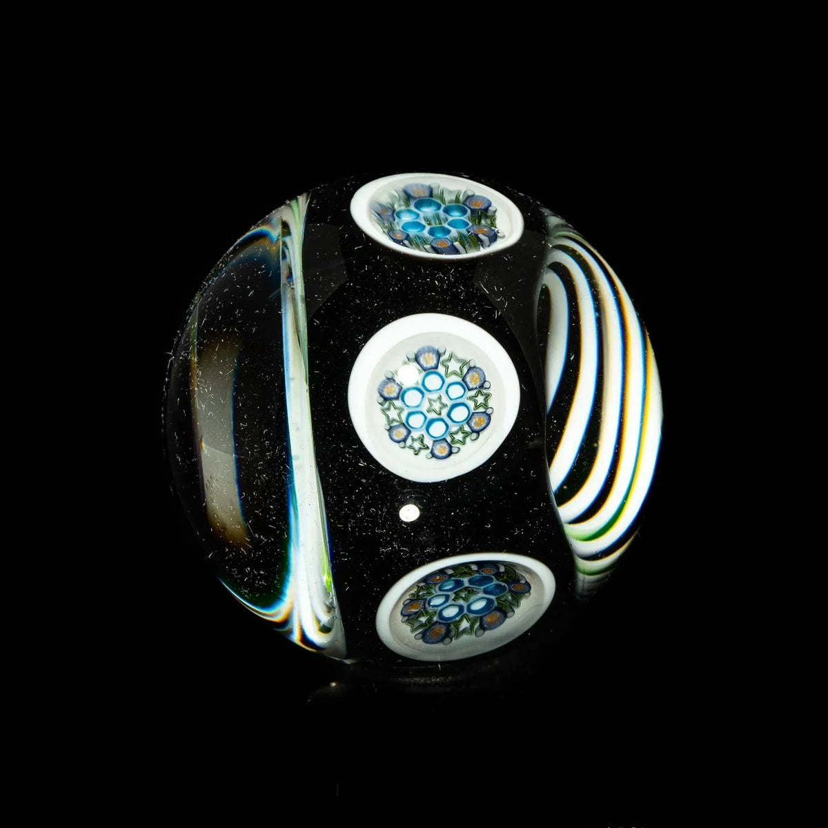 Heady glass marble with detailed blue millefiori patterns on black, artisan glass art