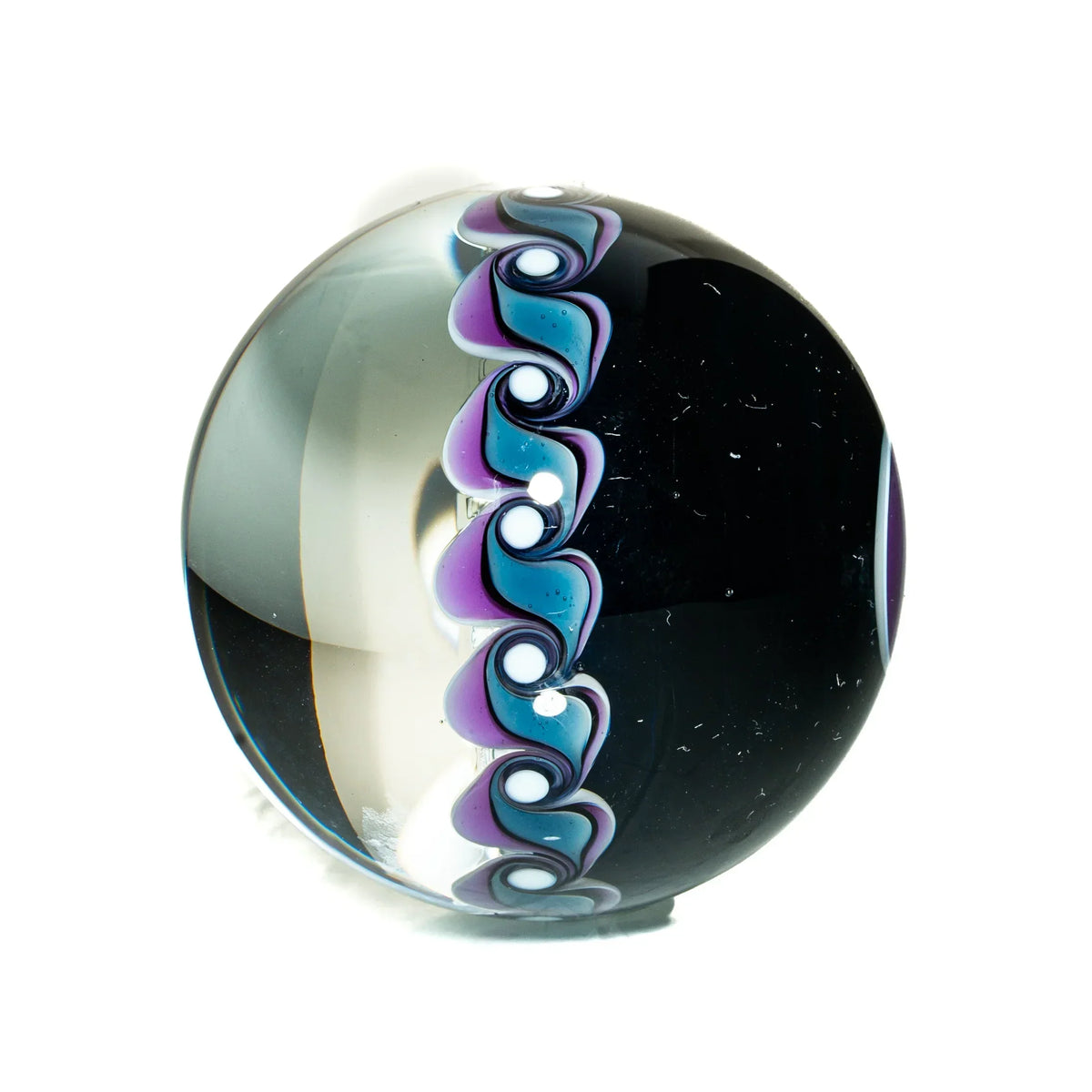Handcrafted glass marble with black, blue, and purple swirl design, art glass sphere