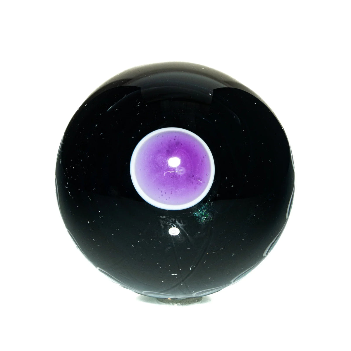 Hand-blown glass orb with a central purple and white design on a black background