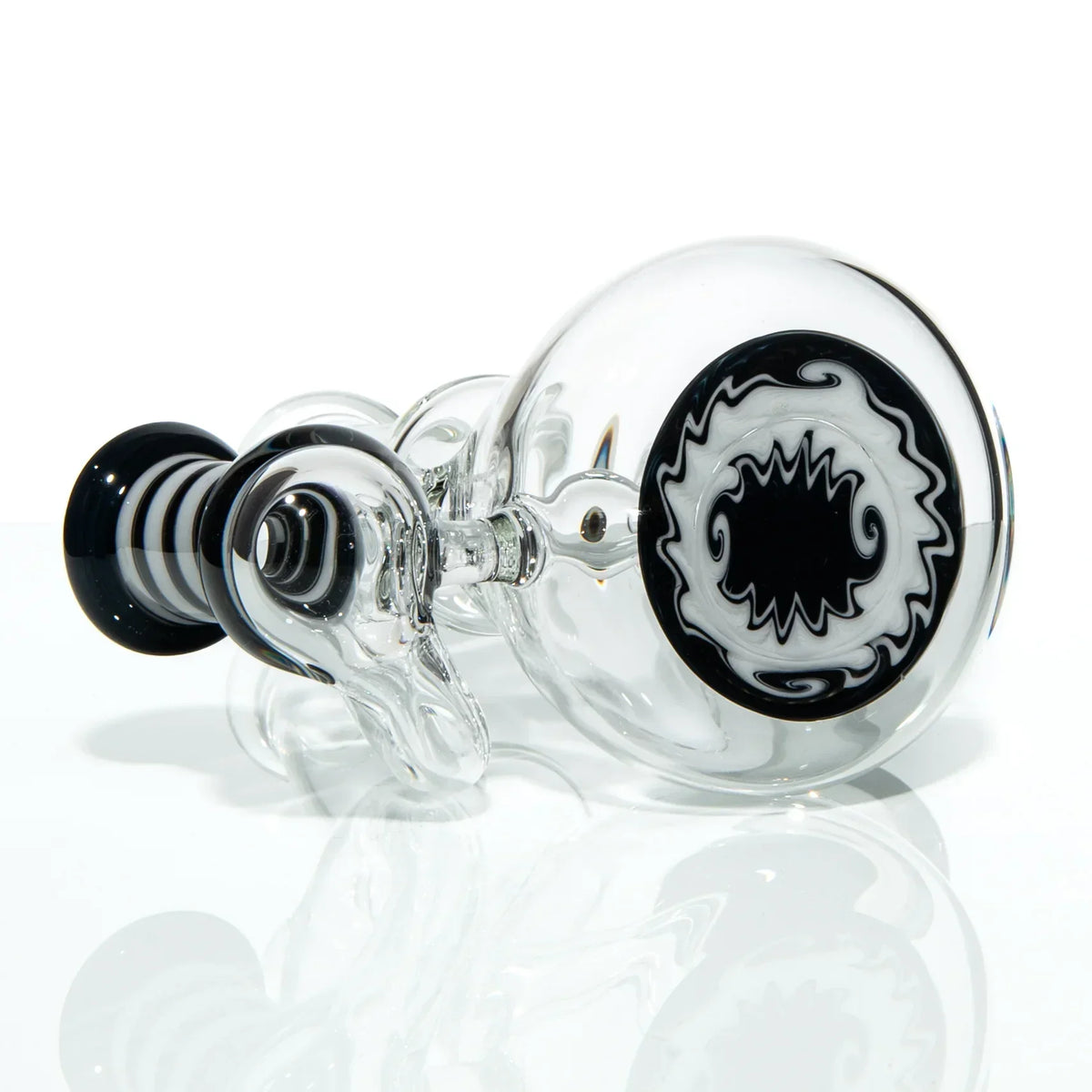 Hand-blown glass pipe with black and white spiral art, clear body, modern smoking accessory