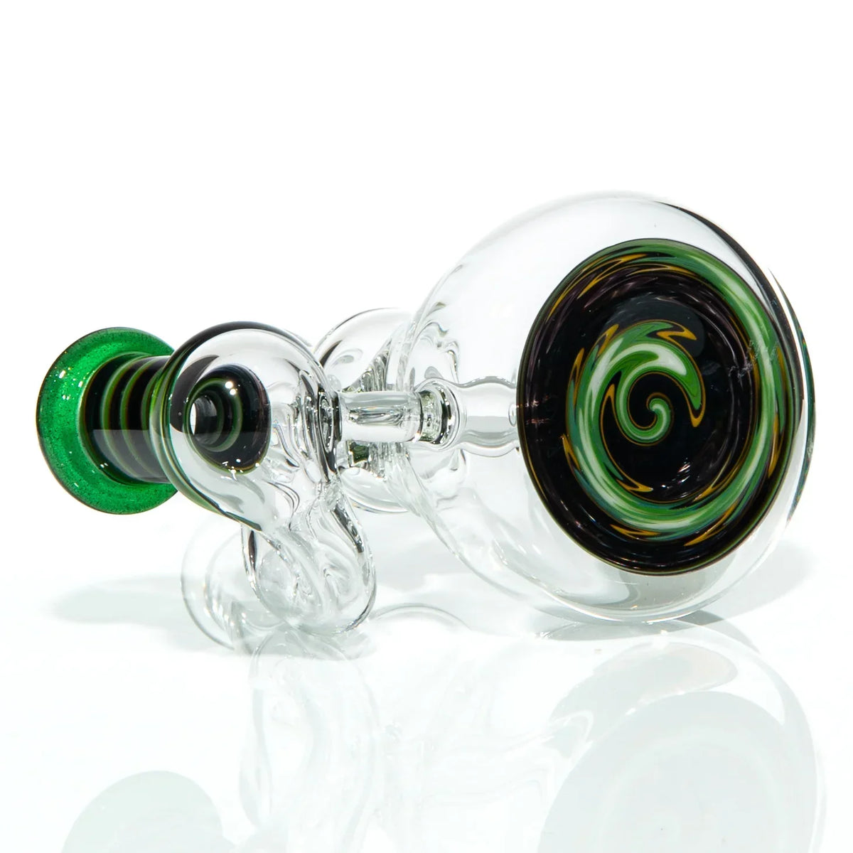 Heady glass pipe with clear body, green accents, and black-yellow-green swirl design