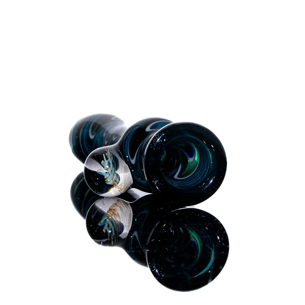 Blue and teal glass chillum pipe with white linework and decorative marbles on white background