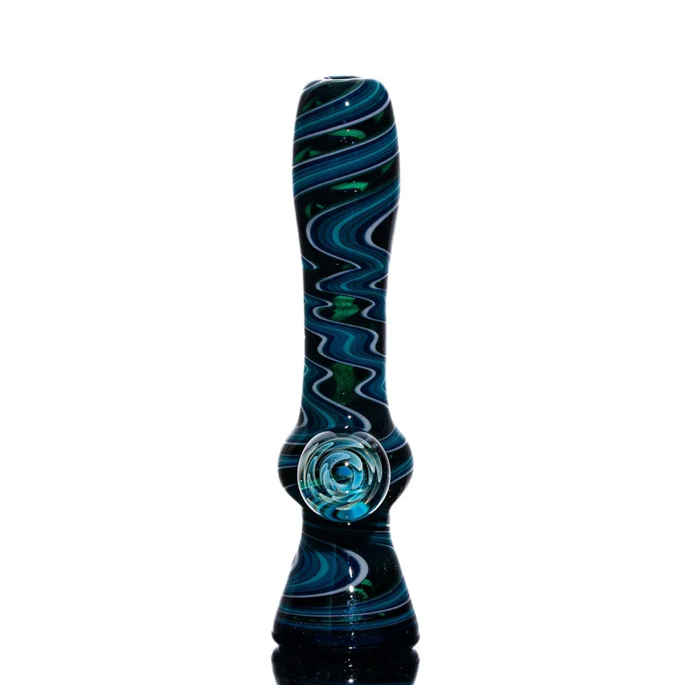Blue teal glass chillum pipe with white swirl linework on white background