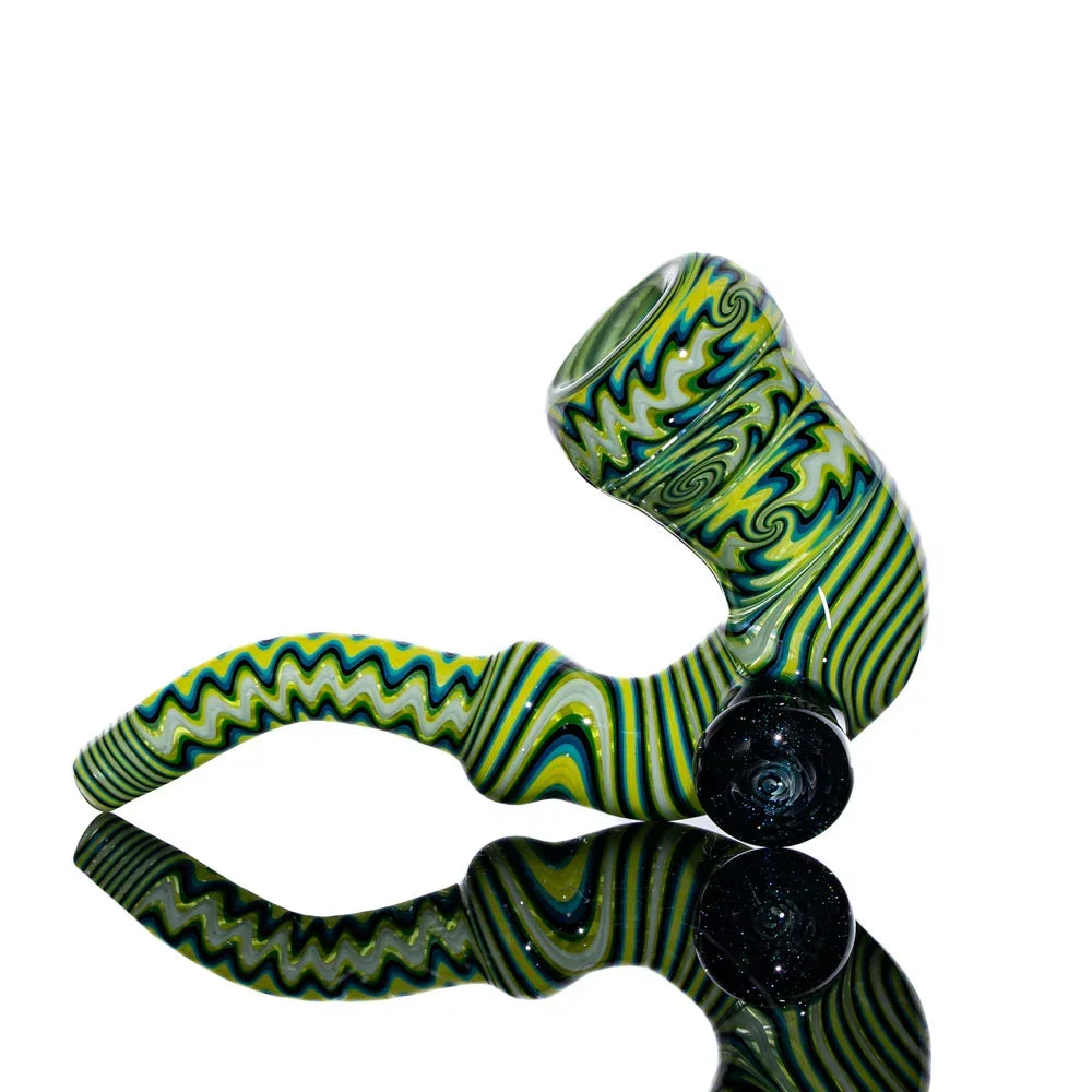 Heady glass sherlock pipe with green, yellow, and black linework on reflective surface