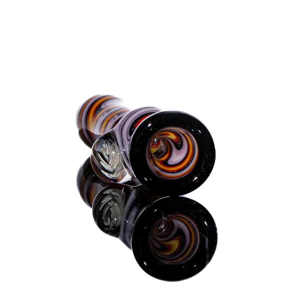Hand-blown chillum pipe with orange, white, and black linework swirl design on glass