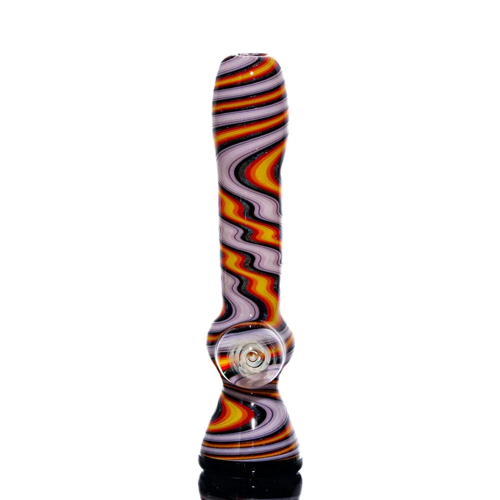 Colorful glass chillum with orange, white, and black swirling linework on a white background