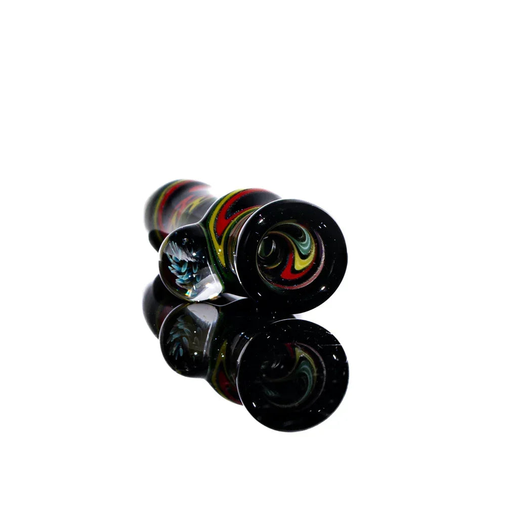 Handcrafted glass chillum with rasta linework, red, yellow, and green swirls on black