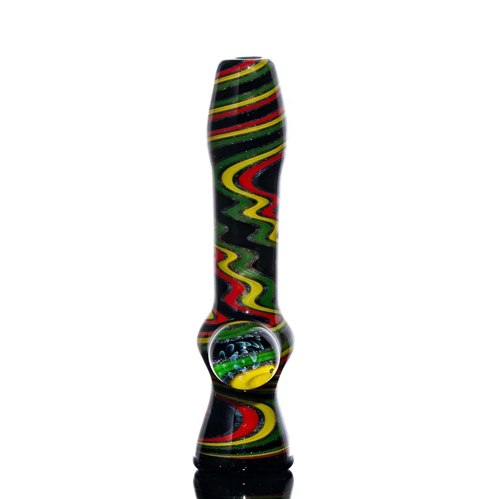 Hand-blown glass chillum with rasta linework in red, yellow, and green on black background