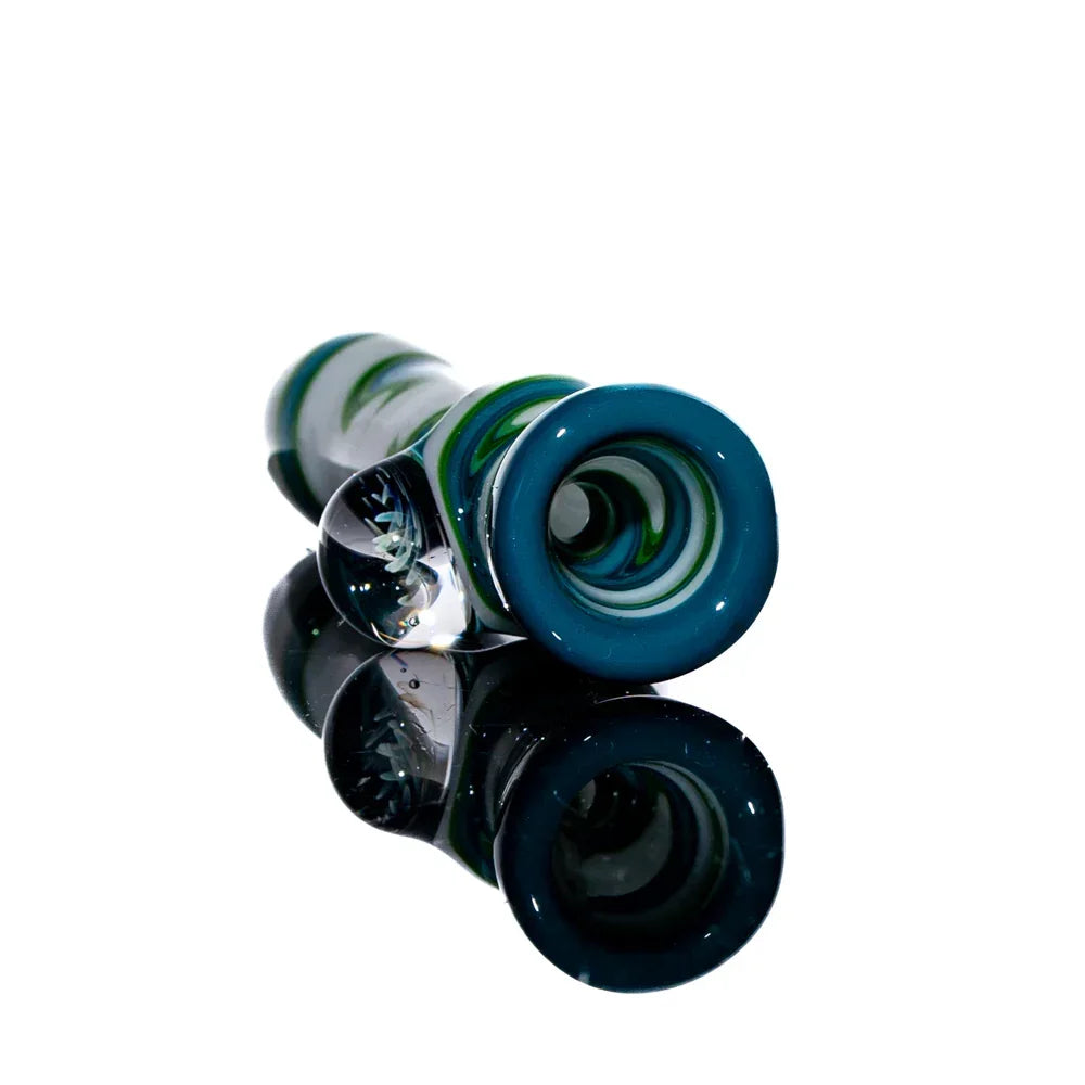 Teal and green glass chillum with white linework, reflective display, art glass pipe