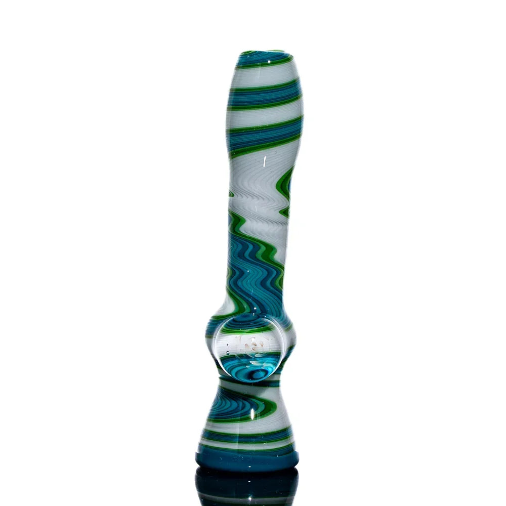 Teal, green, and white glass chillum with wavy linework and clear detail, displayed upright.