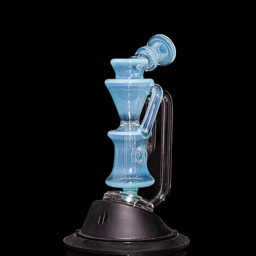 Blue glass recycler water pipe with angled neck and handle on black background