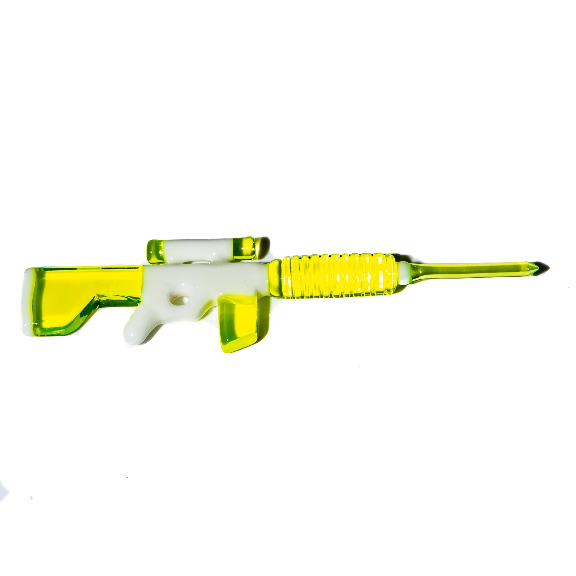 Yellow and white rifle-shaped glass pipe on a white background