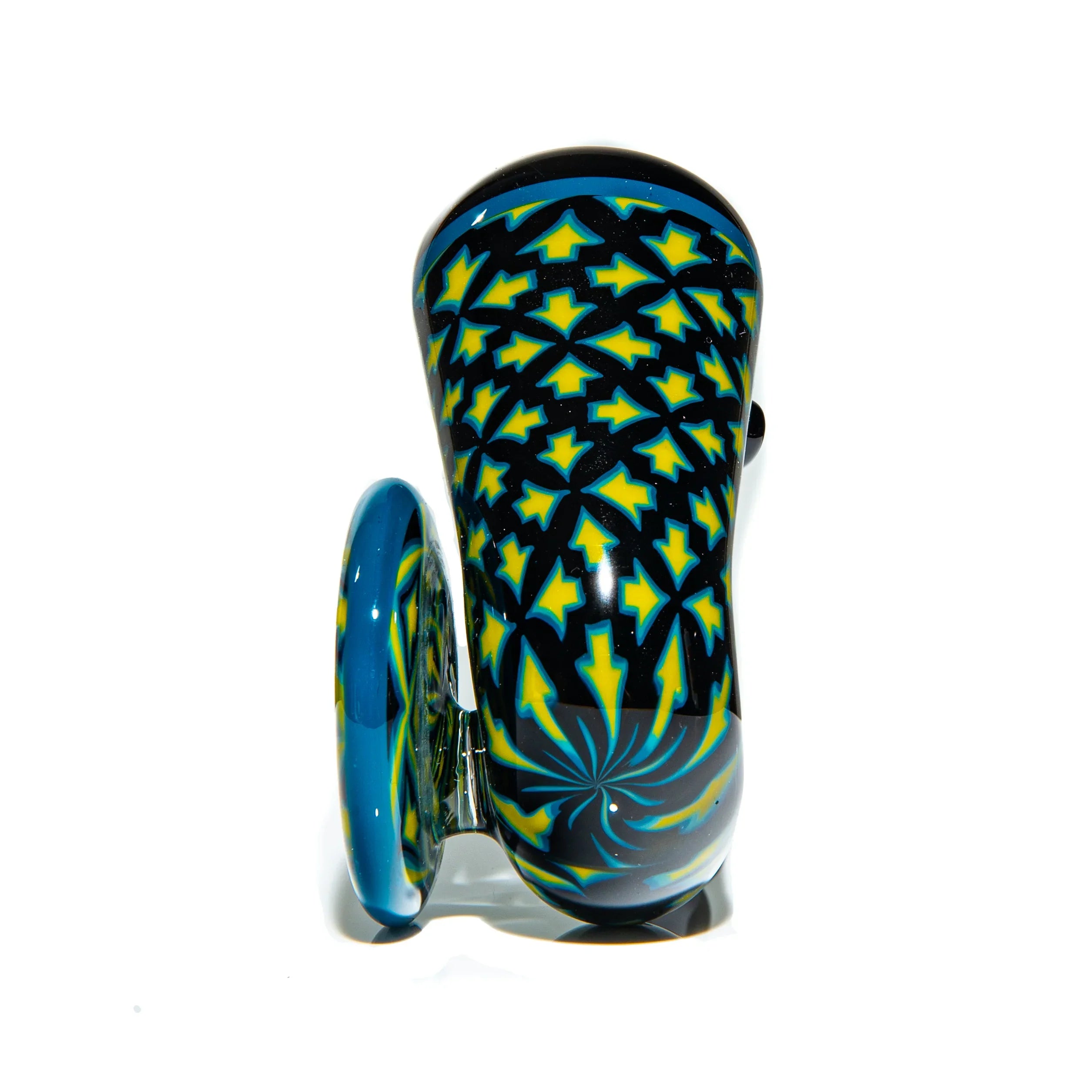 Hand-blown glass pipe with intricate yellow and blue geometric patterns on a black base