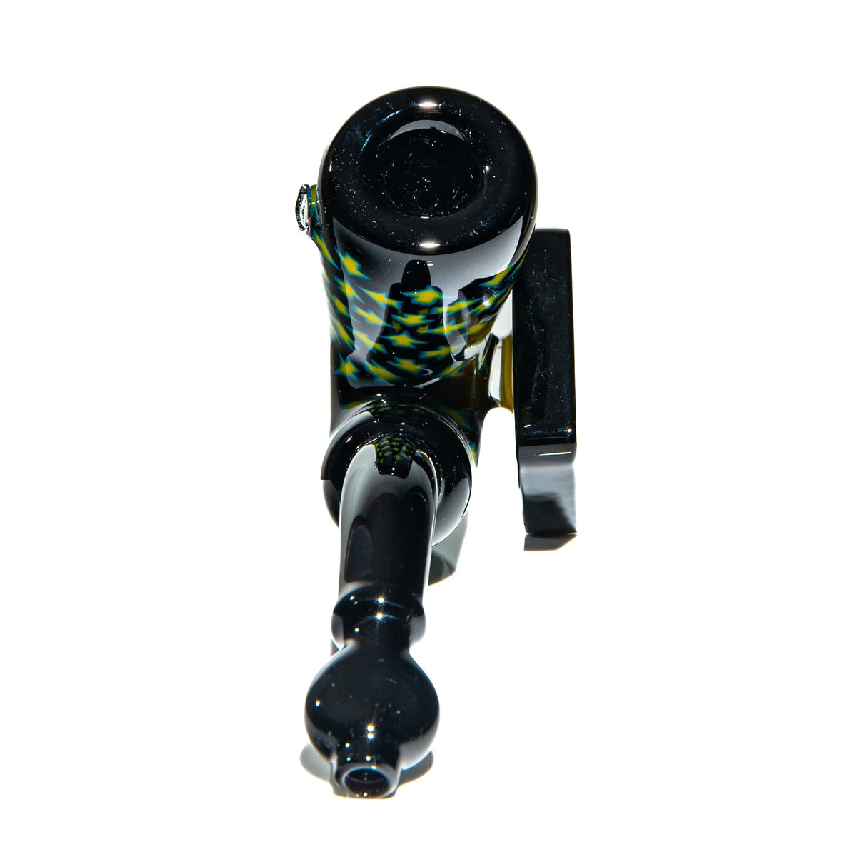 Black glass dry pipe with intricate patterns on white background