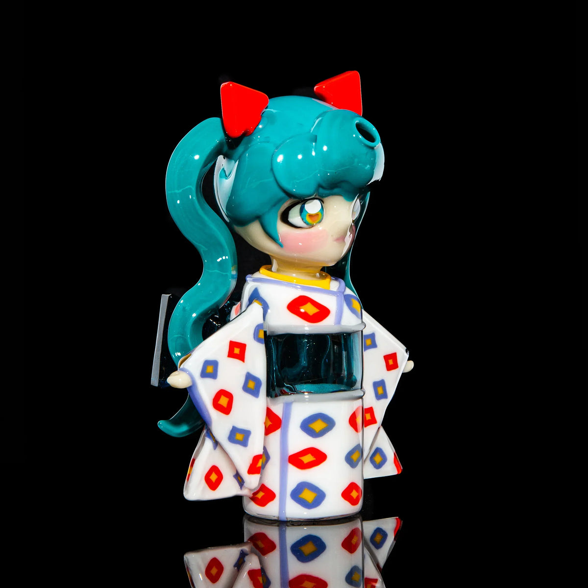 Hand-blown glass pipe shaped like an anime girl in a patterned kimono with teal hair.