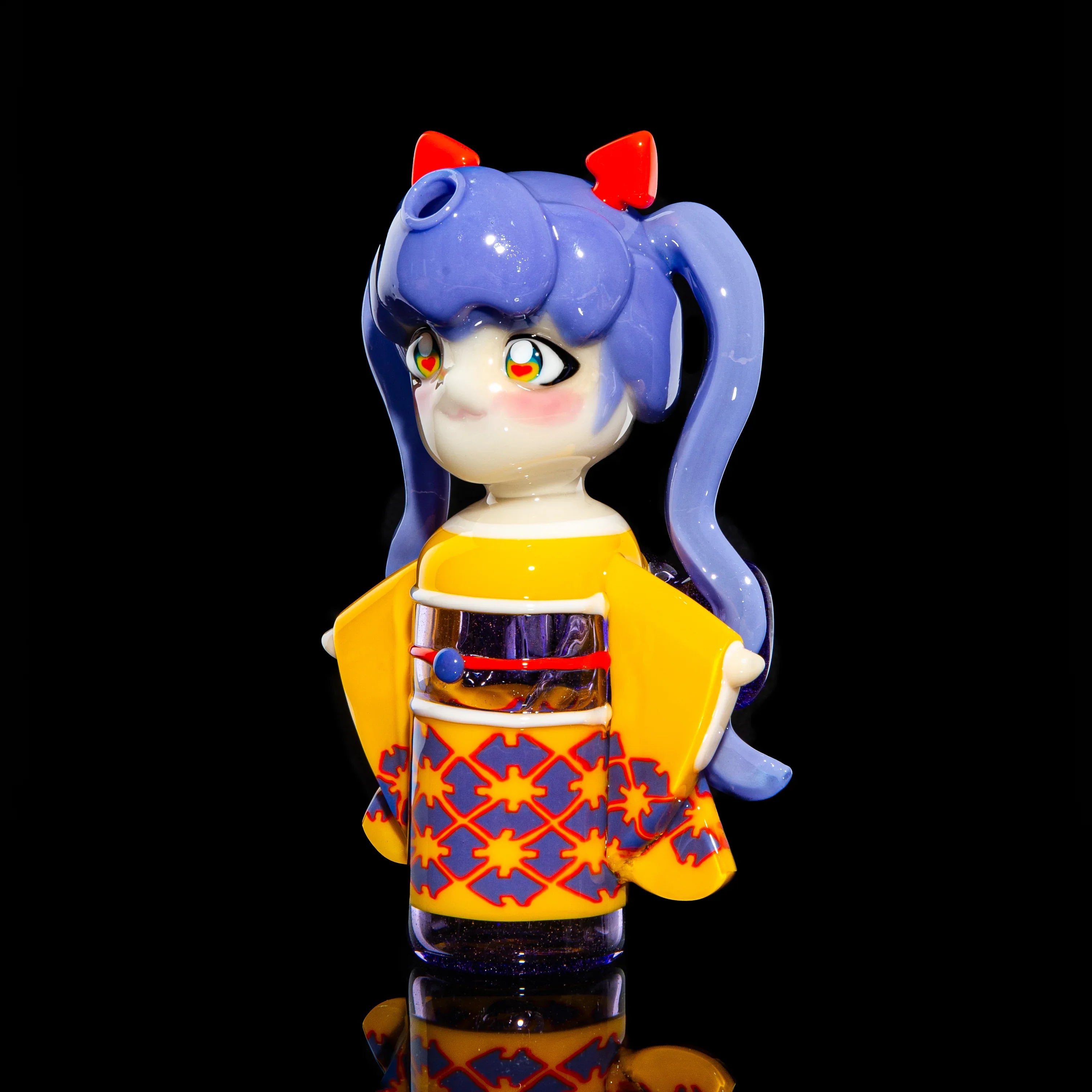 Handcrafted glass art pipe shaped like an anime girl with blue hair and a yellow kimono