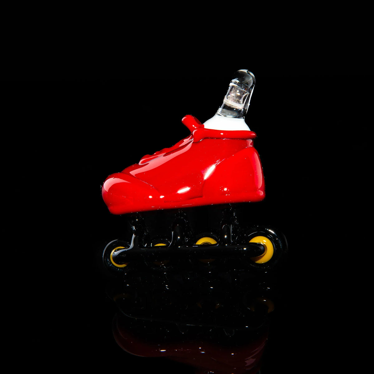 Red glass rollerblade pipe with yellow wheels on a black background