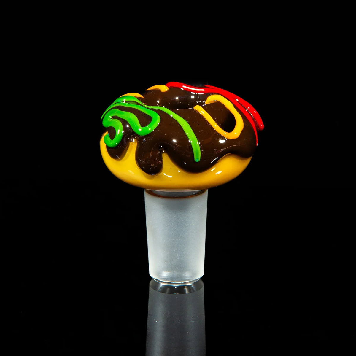 Colorful glass bowl slide with chocolate, red, yellow, and green swirl accents, 18mm joint.