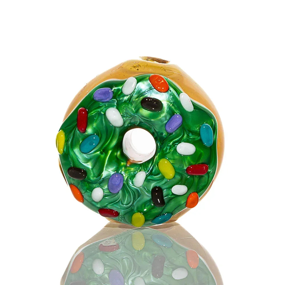 Glass pipe shaped like a mini donut with green frosting and colorful sprinkles.