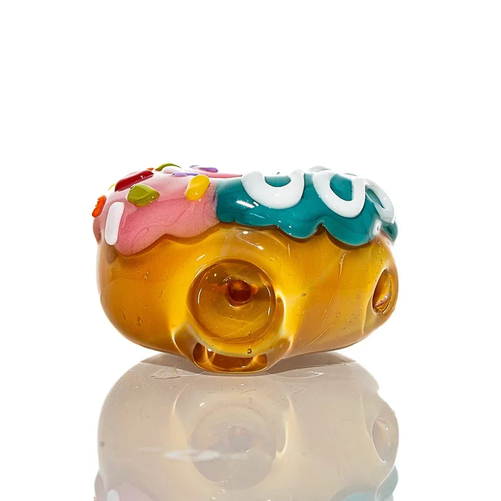 Mini donut glass pipe with pink and blue frosted toppings and colorful sprinkles