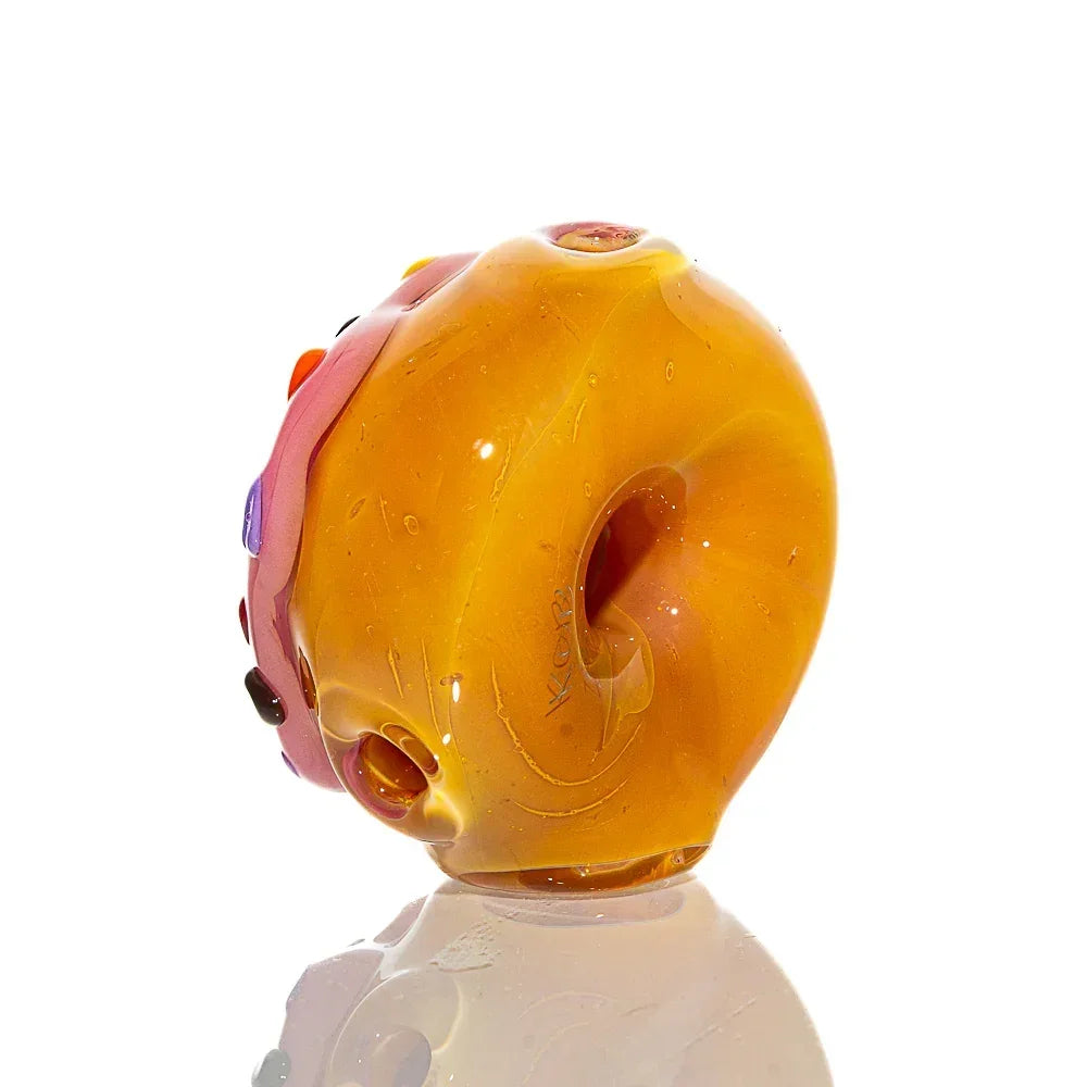 Mini donut-shaped glass hand pipe with strawberry pink frosting and colorful sprinkles
