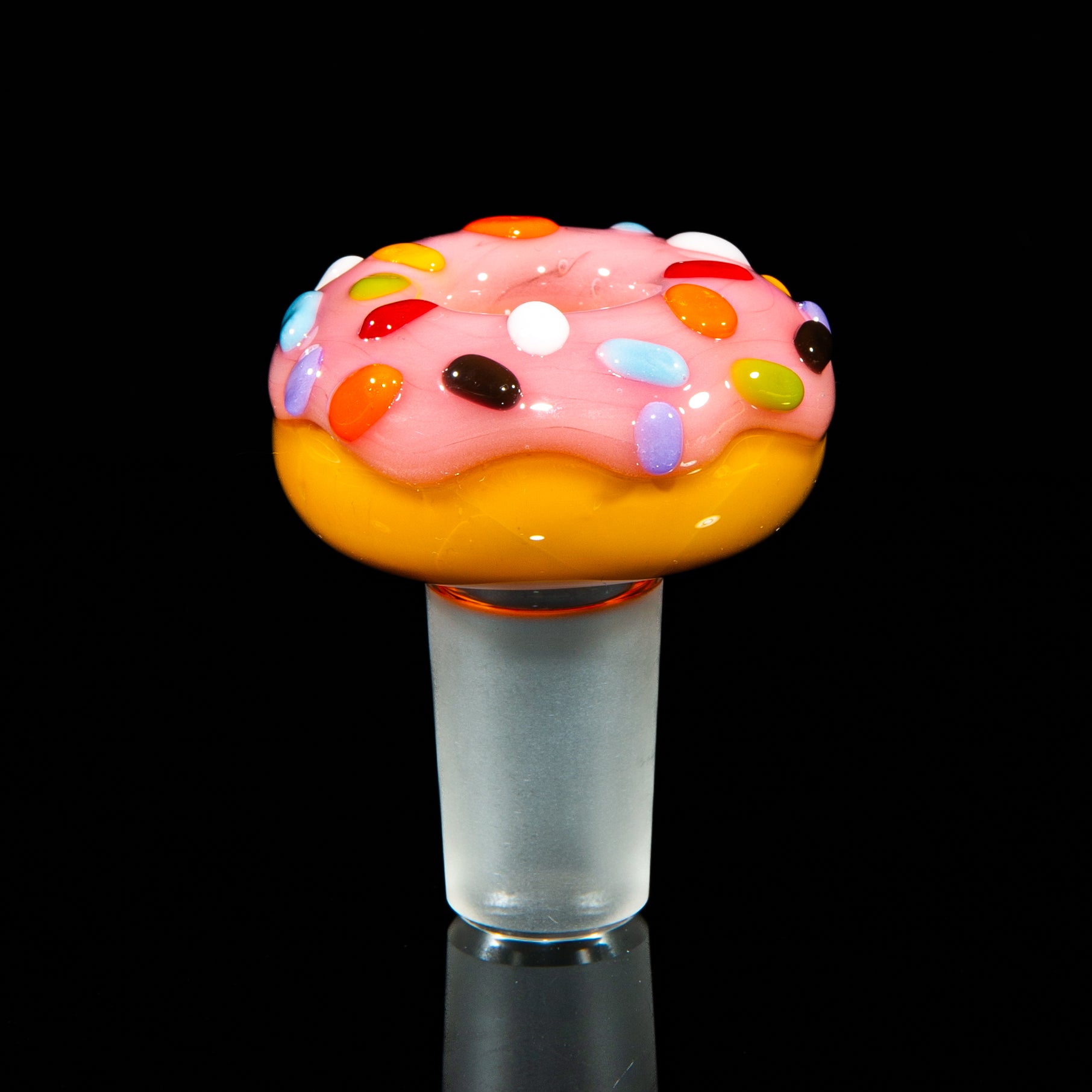Donut-shaped glass bowl slide with pink frosting and colorful rainbow sprinkles