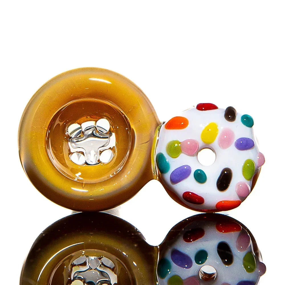 Handmade glass donut-shaped pipe with vanilla frosted sprinkle design and glossy finish