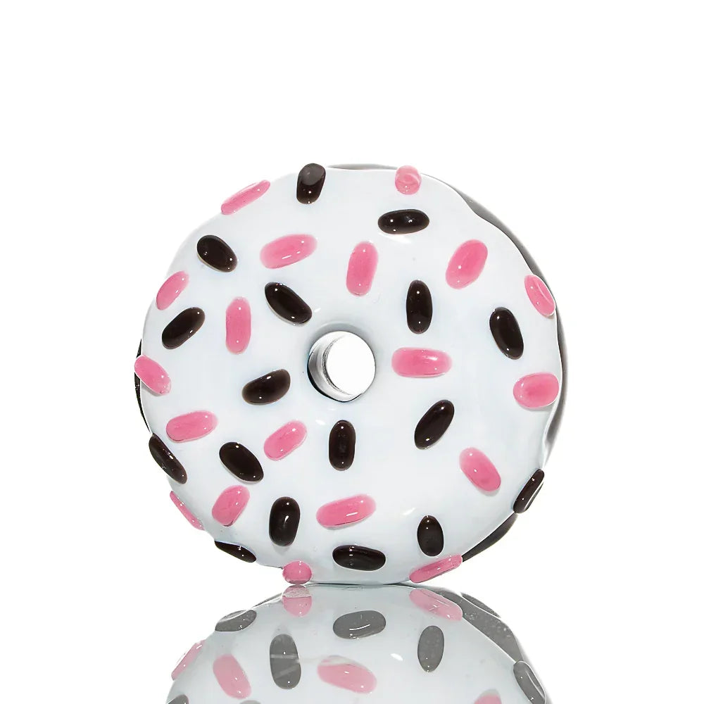 Glass hand pipe shaped like a chocolate donut with white frosting and pink, brown sprinkles
