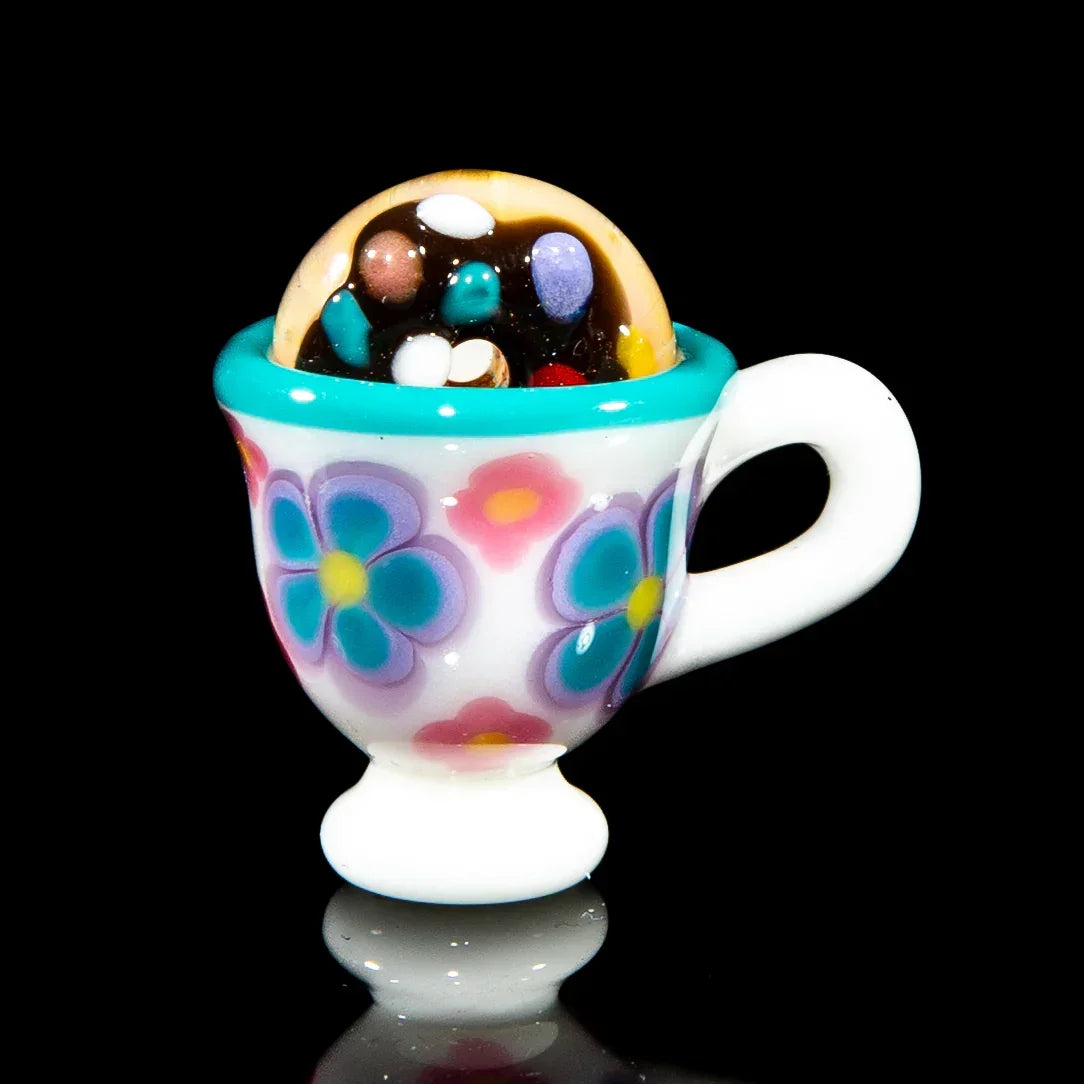 Floral glass teacup pendant with chocolate donut and colorful sprinkles design