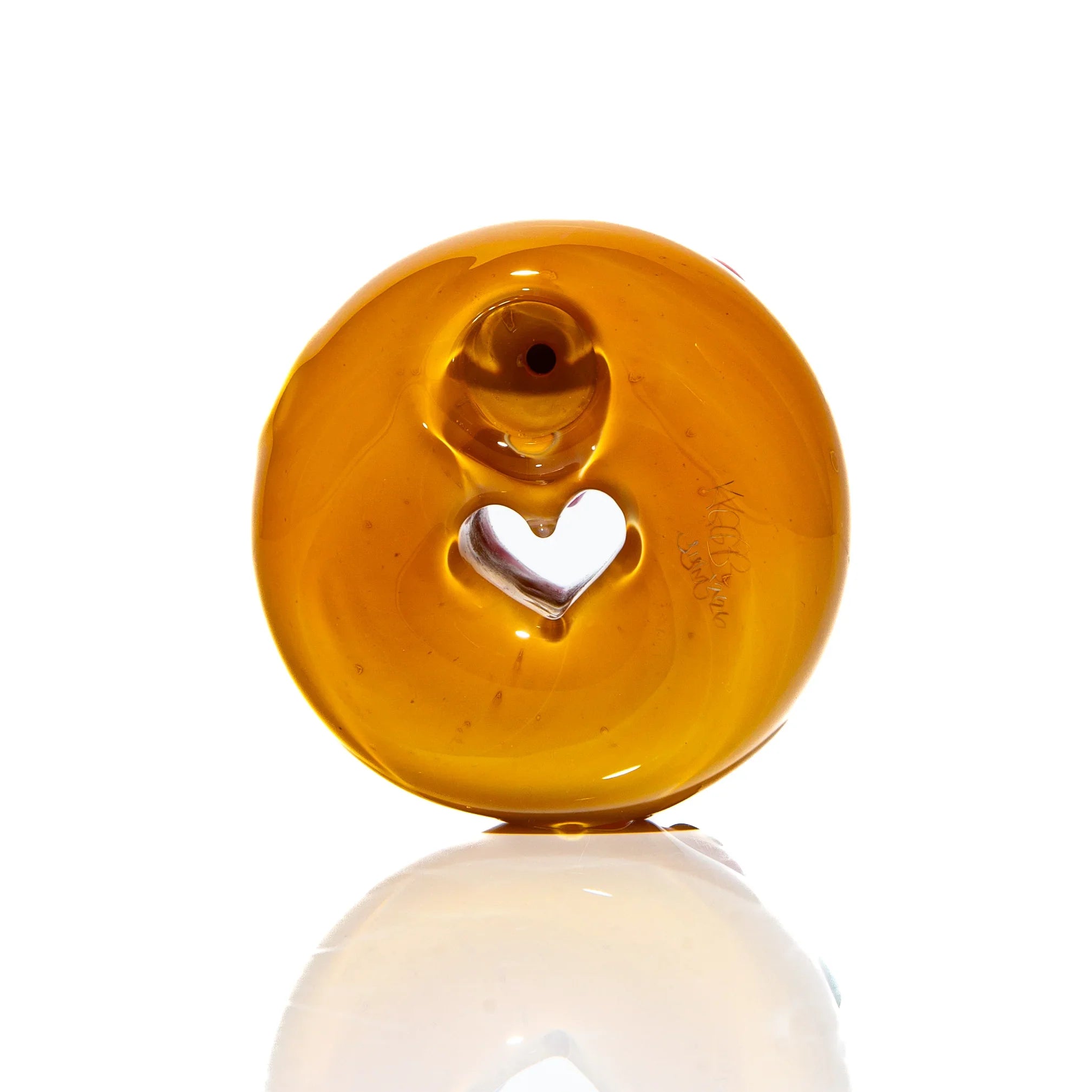 Amber glass donut pipe with heart-shaped hole, unique hand-blown smoking accessory