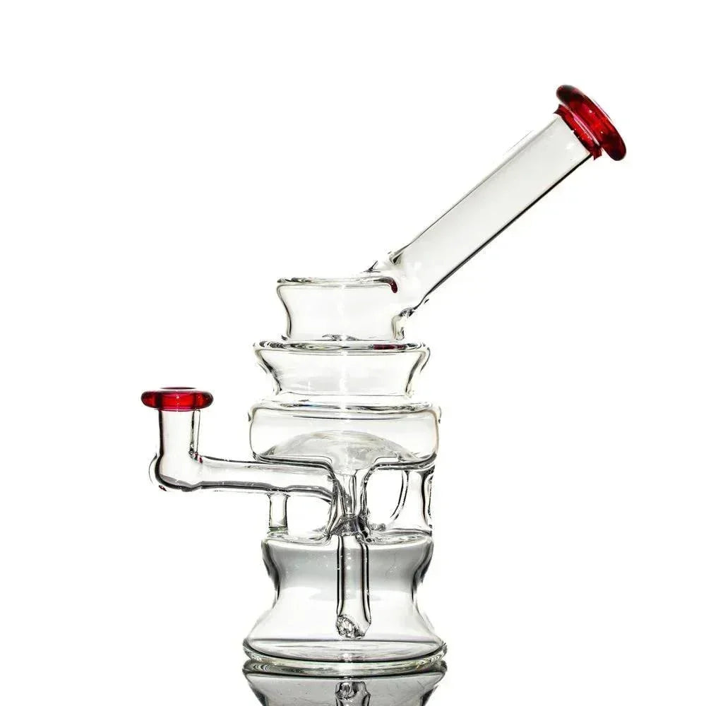 Clear glass water pipe with red accents, unique recycler design, on white background.