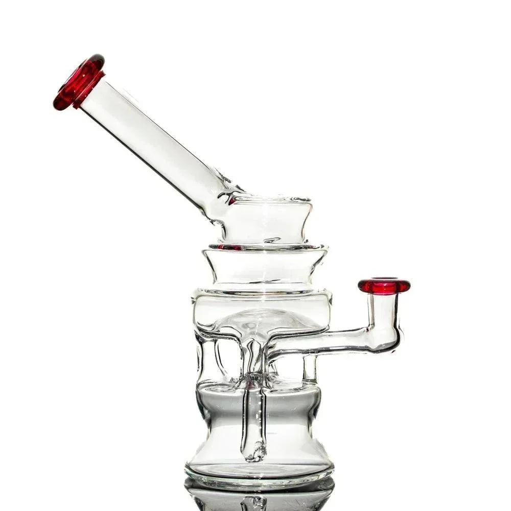 Clear glass water pipe with intricate percolator design and red accents on mouthpiece and joint