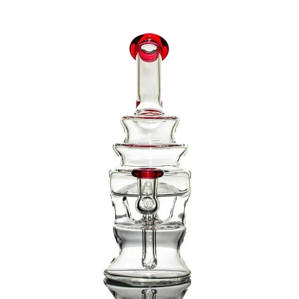 Clear glass water pipe with gold and ruby accents, unique stacked chamber design, on white background