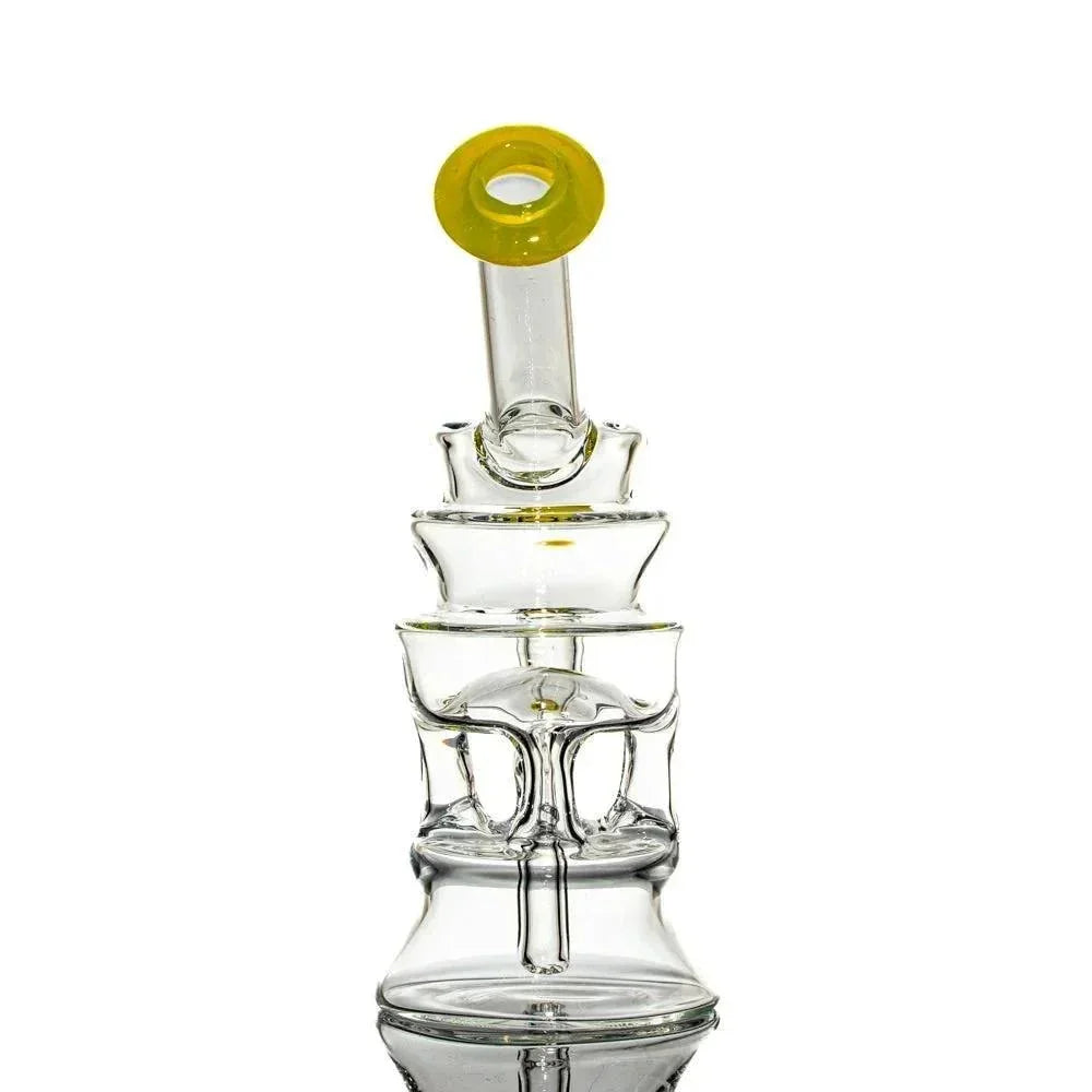 Clear glass water pipe with unique tiered design and yellow accented mouthpiece