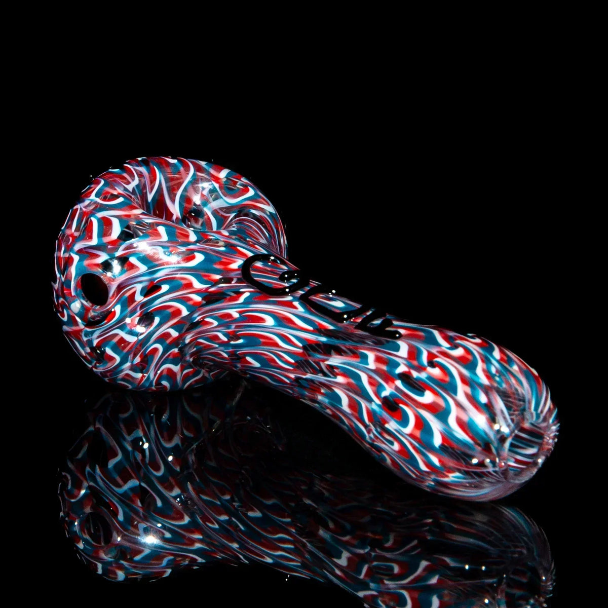 Colorful glass hand pipe with red, white, and blue swirl pattern on black background