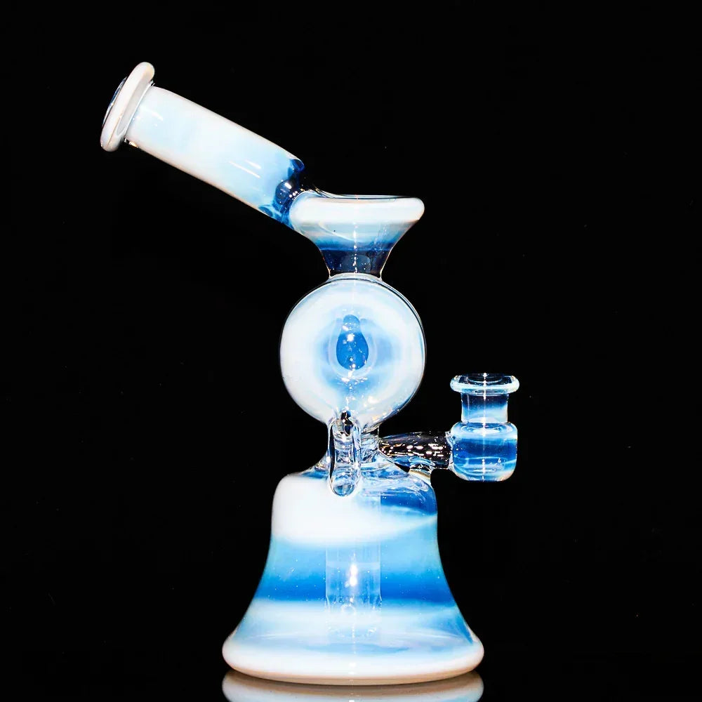 Blue and white glass recycler water pipe with split window design against black background