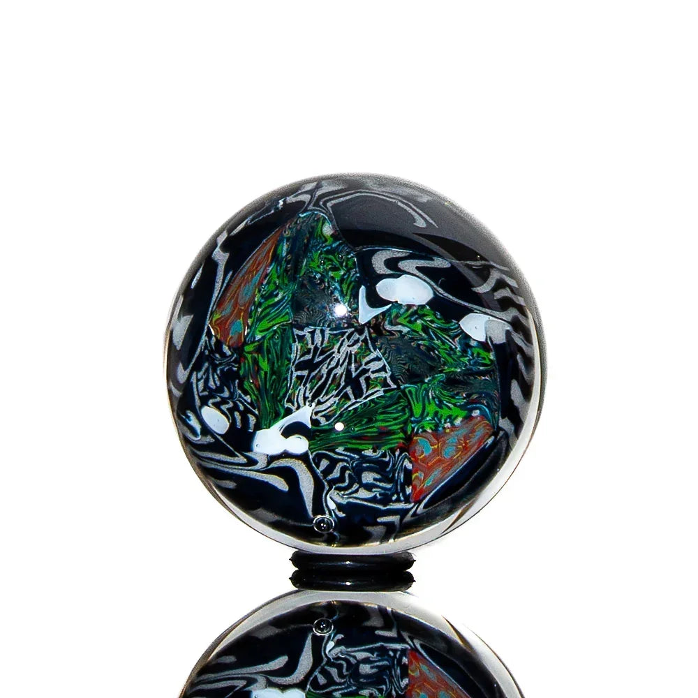 Colorful marble carb cap with intricate green, orange, and white glass design for water pipes