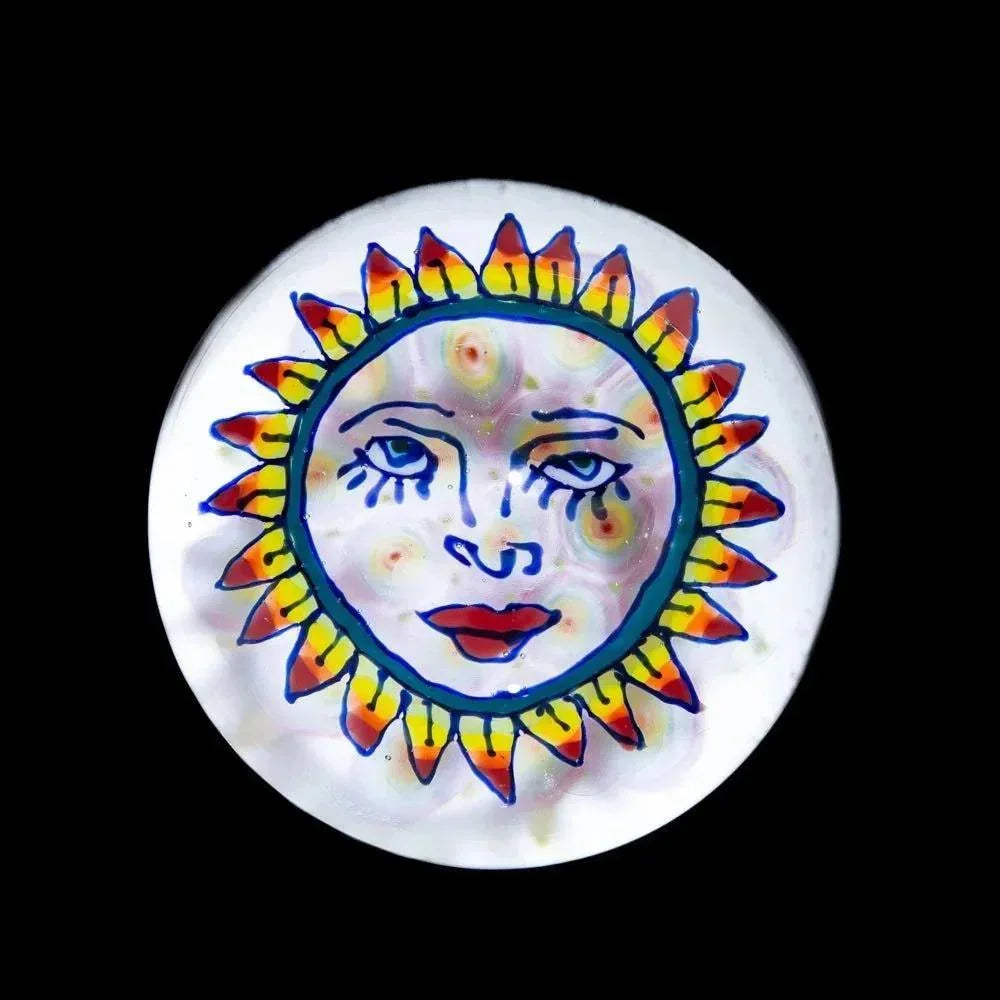 Marble featuring a colorful sun face design on white glass, smoke shop glass accessory