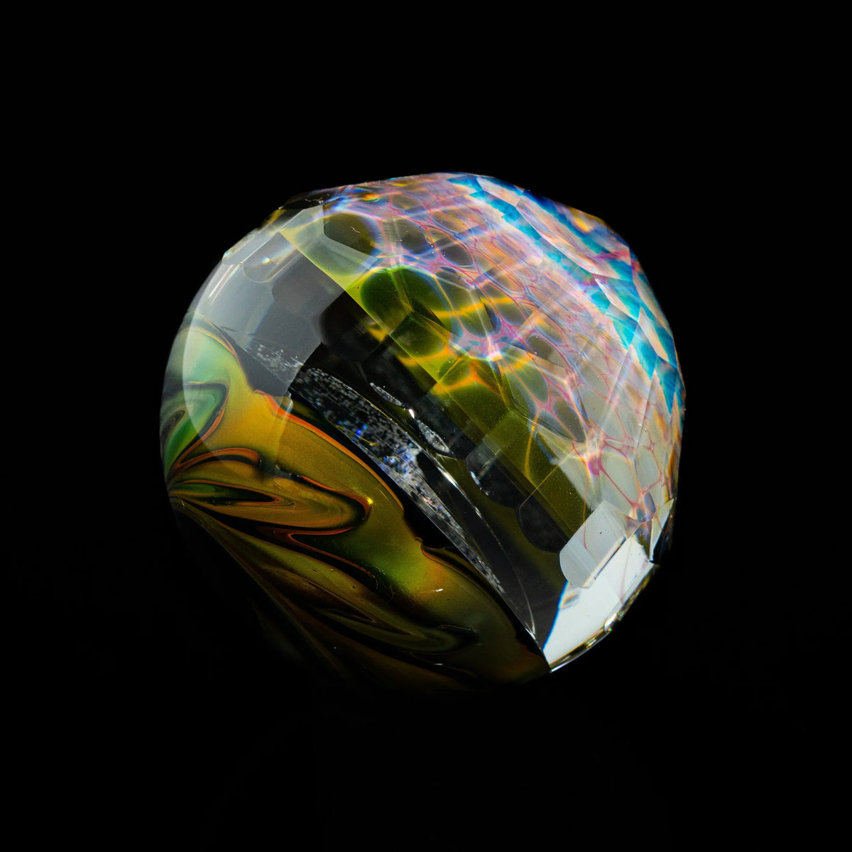 Colorful heady glass art marble with intricate patterns on black background