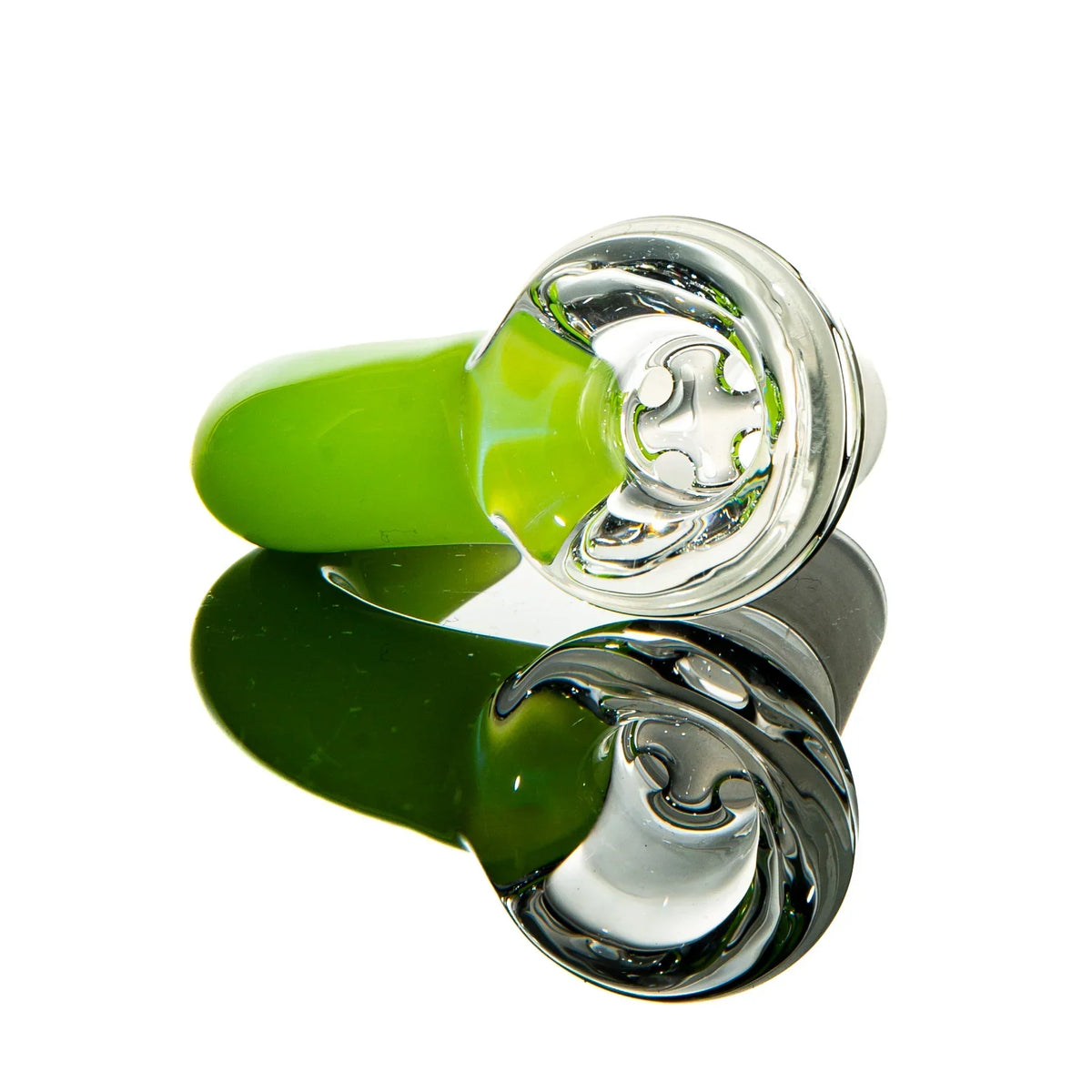Green glass smoking pipe with clear bowl and cross-shaped filter, reflected on white background.