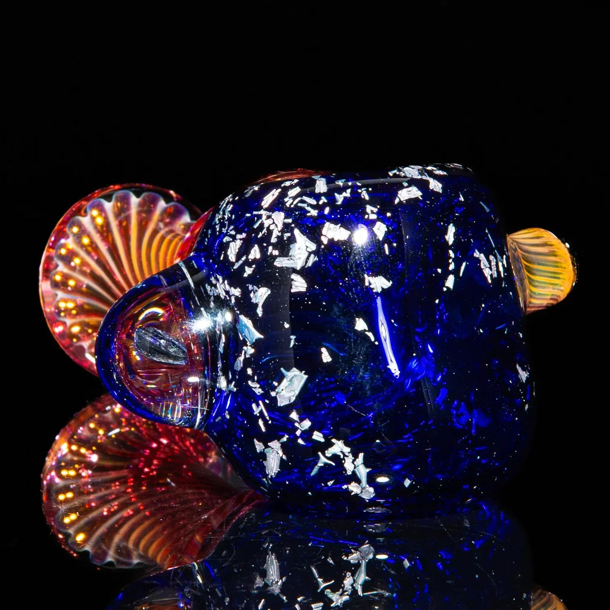 Large blue glass spoon pipe with silver fume accents and vibrant decorative details