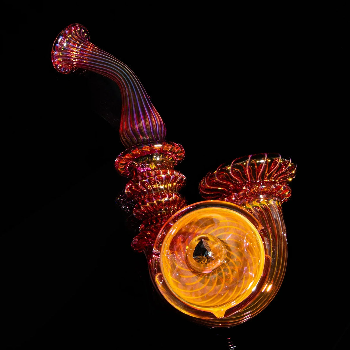 Large fume sherlock glass pipe with intricate orange and gold patterns on a black background.
