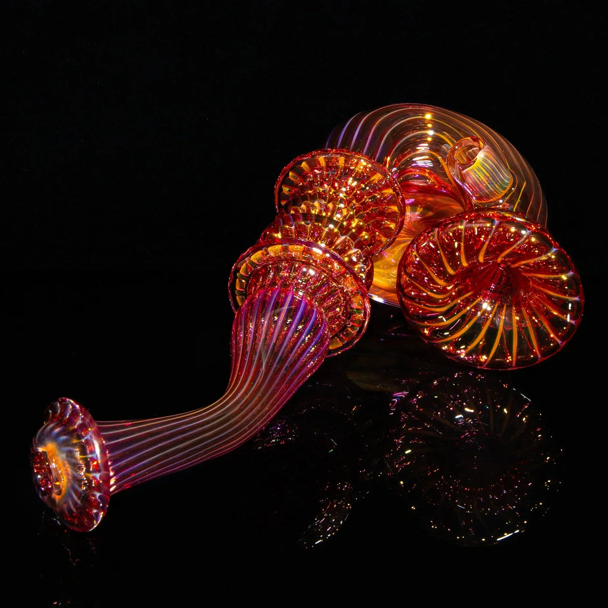 Handcrafted fumed glass Sherlock pipe with vibrant orange and gold swirls on black background