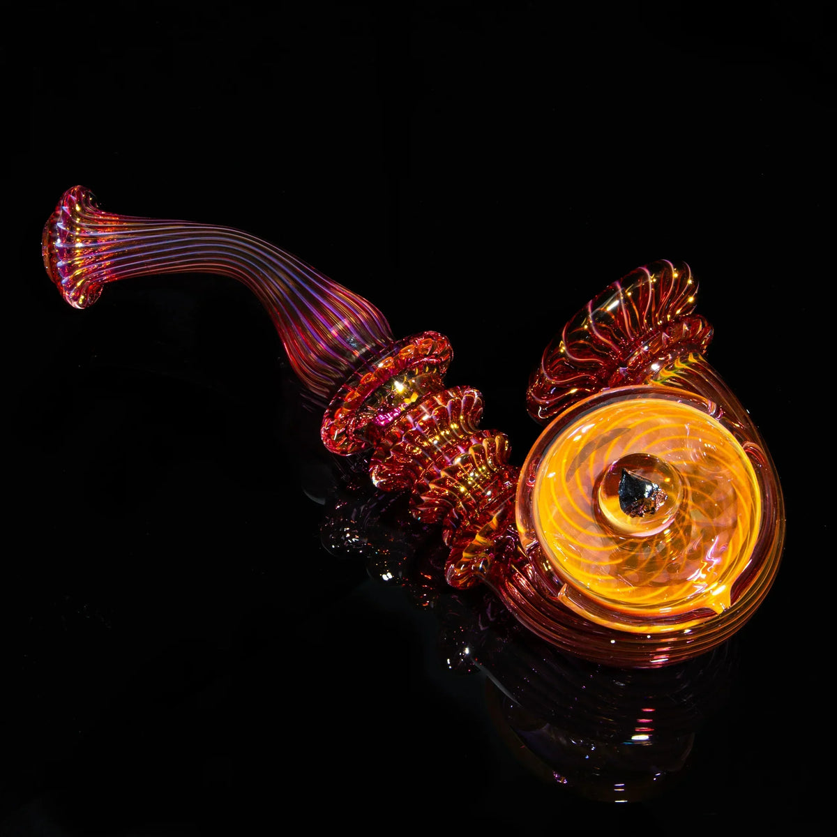 Large fumed glass Sherlock pipe with vibrant orange and gold swirls on a black background