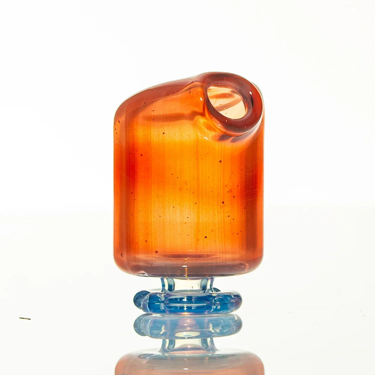 Hand-blown orange glass mouthpiece with blue base, displayed on white background