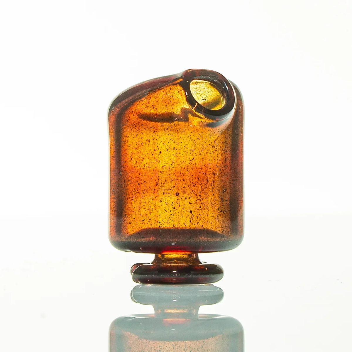 Amber glass mouthpiece with rounded edges and side opening on white background