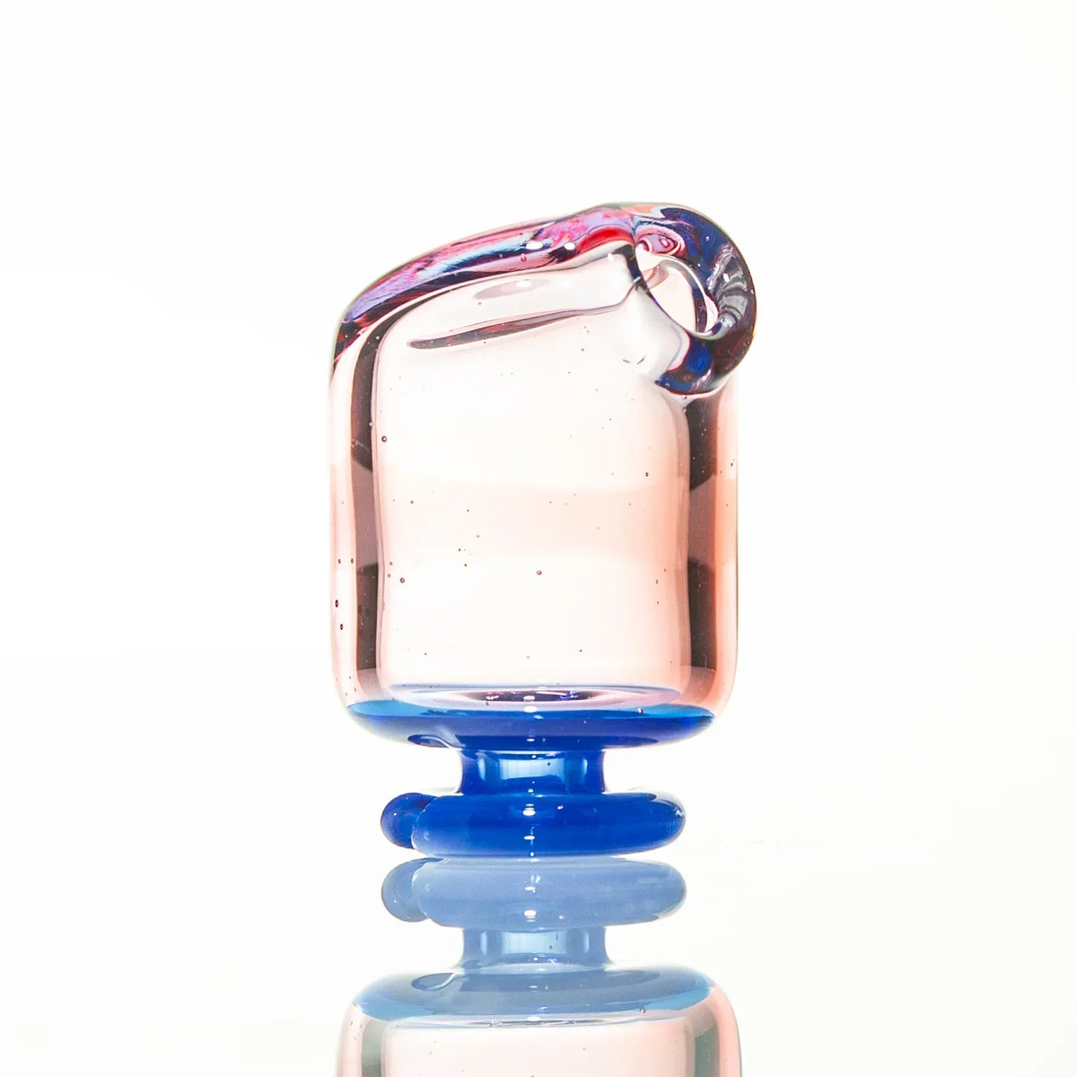 Artisan glass mouthpiece with pink and blue accents on a white background