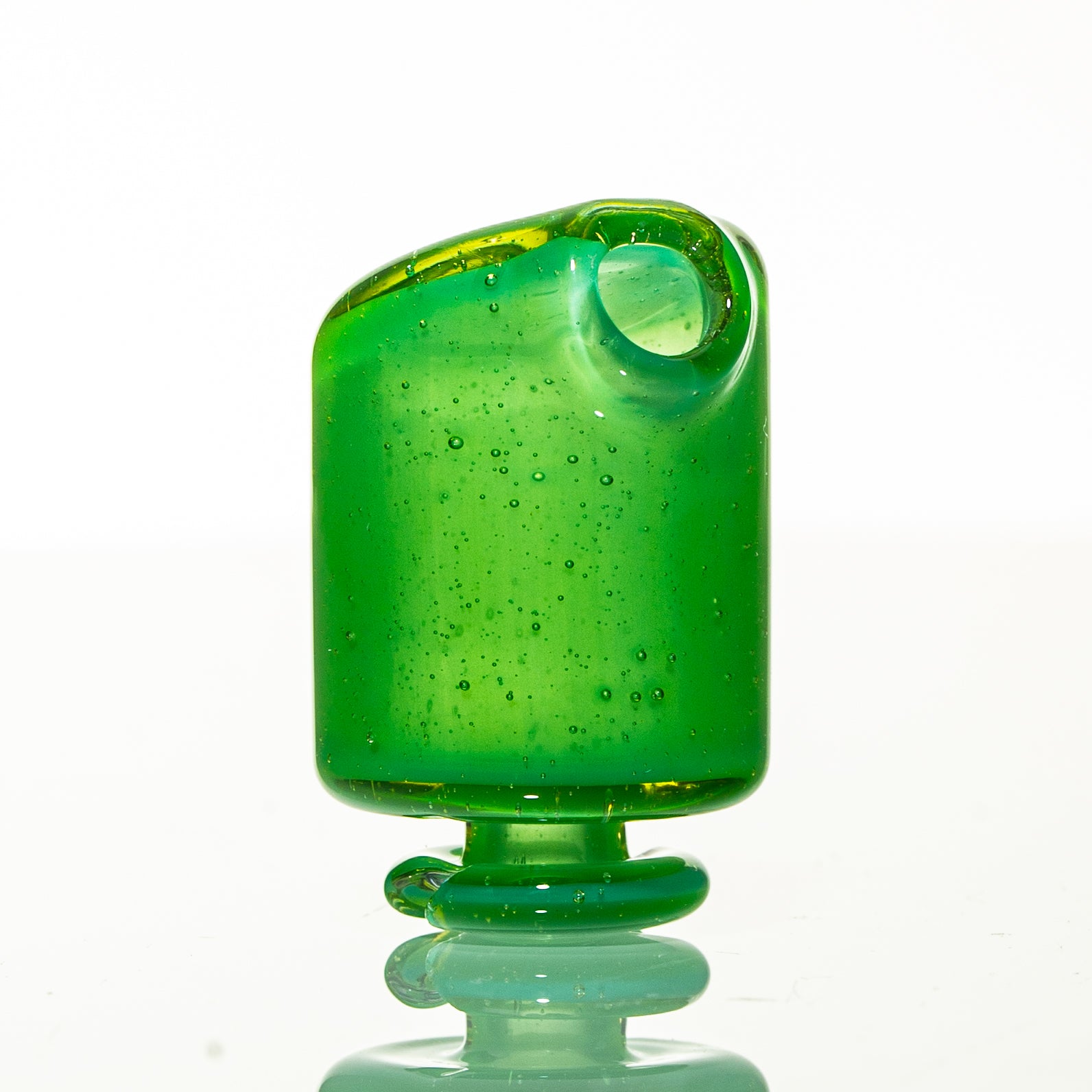 Green glass mouthpiece accessory with rounded edges and bubble details on a white background